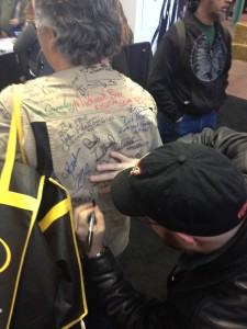 This is Cam Edwards signing a shirt from a very excited NRA member. The things they ask people to sign. 